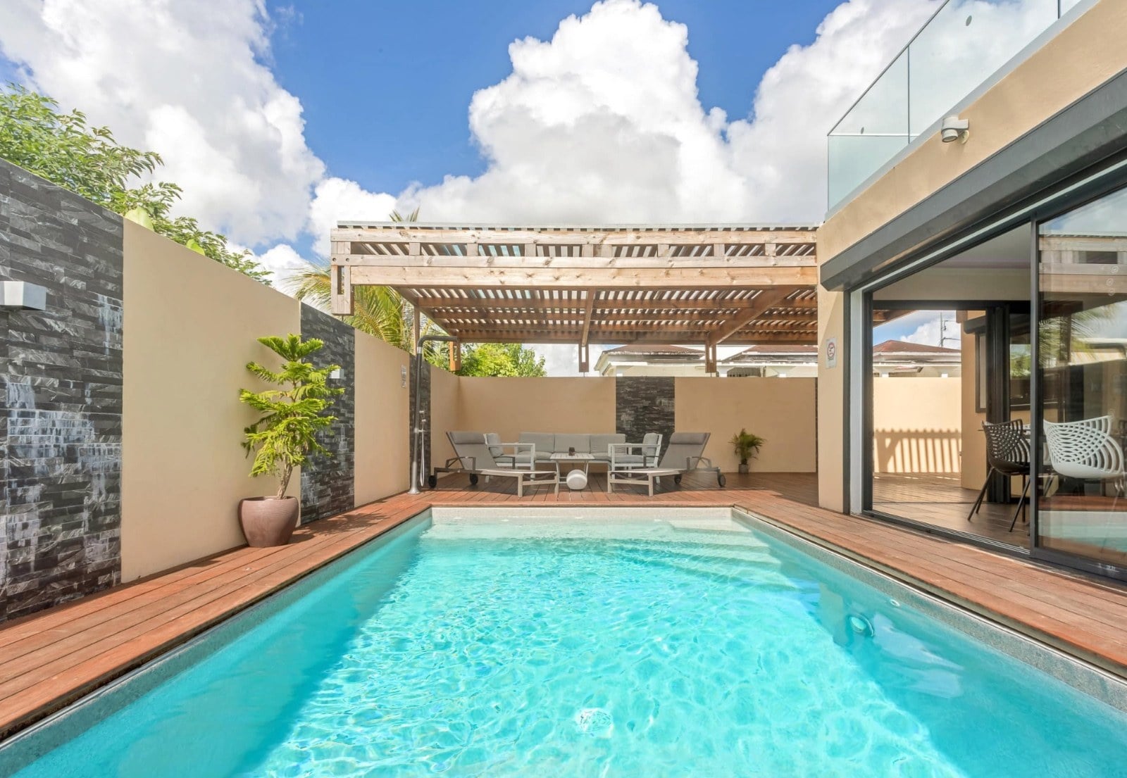 The heated pool and its wooden deck